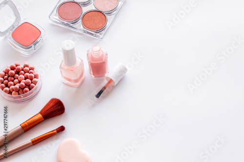 Decorative cosmetics frame with rounge, powder and tools on white background copy space