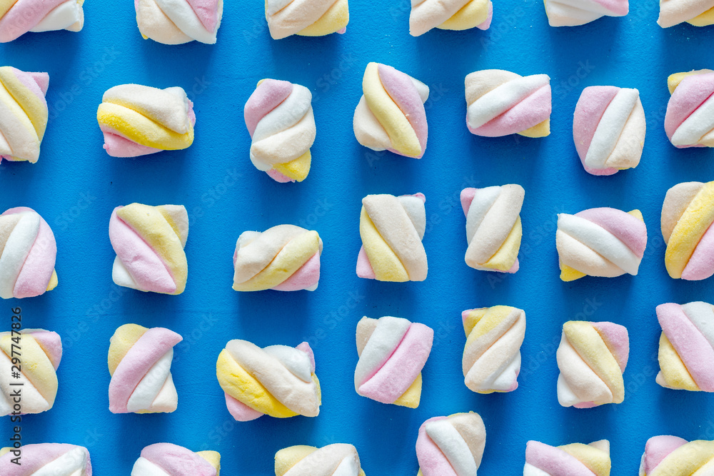 Marshmallows pattern on blue background top view flat lay Marshmallows pattern on blue background top view flat lay