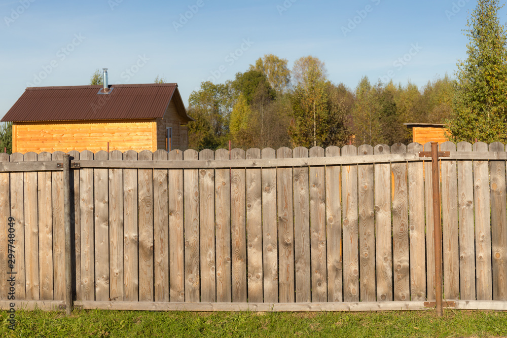 fence from boards in the village