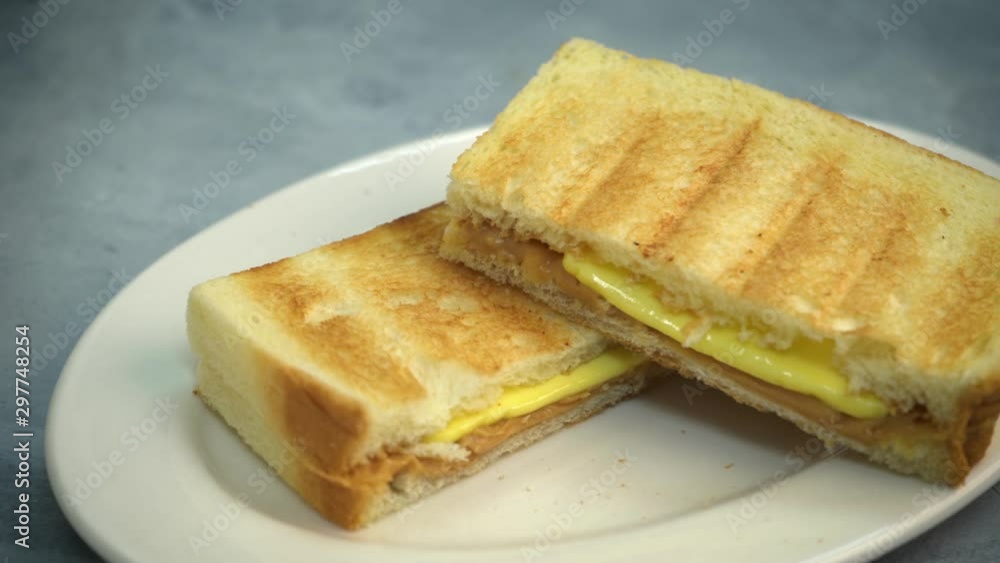 Steamed bread with Kaya and butter. Kaya toast. Traditional Singapore breakfast. Soft focus. Steamed bread with Kaya and butter. Kaya toast. Traditional Singapore breakfast. Soft focus.