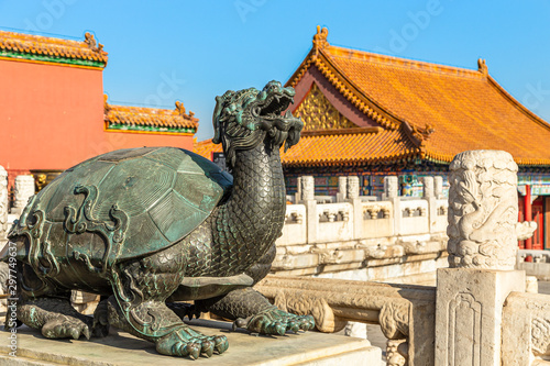 Canvas Print Bronze tortoise with a dragon head statue Baxia, in front of Palace of Heavenly