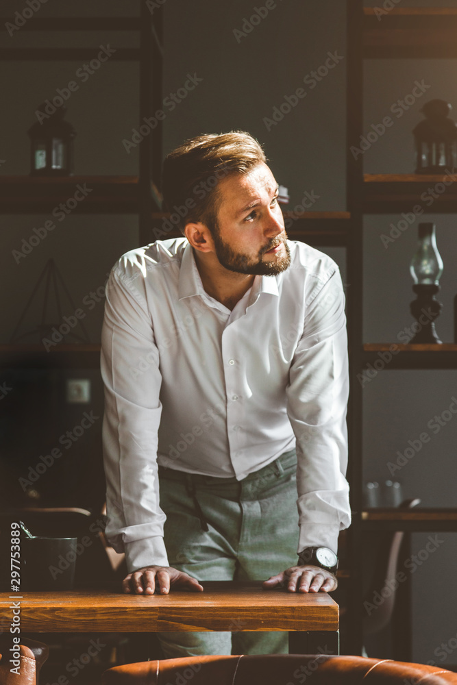portrait of a young businessman in the interior portrait of a young businessman in the interior