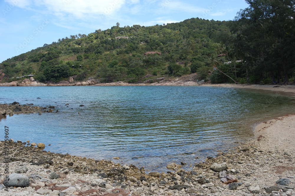 Fototapeta premium The shallow waters of Thong Lang Beach, Koh Phangan, Thailand