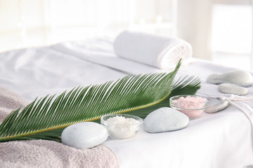 Foto auf Acrylglas Massagesalon Sea salt with spa stones and tropical leaf in beauty salon  © Pixel-Shot