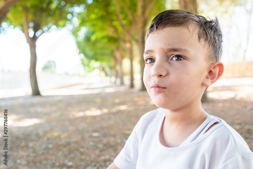 Happy muslim arabic boy playing in hte park Happy muslim arabic boy playing in hte park