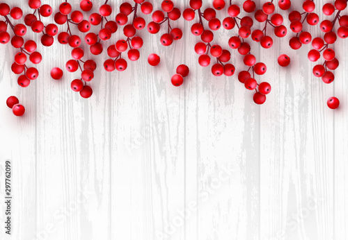 Christmas red holly berry on white wooden background