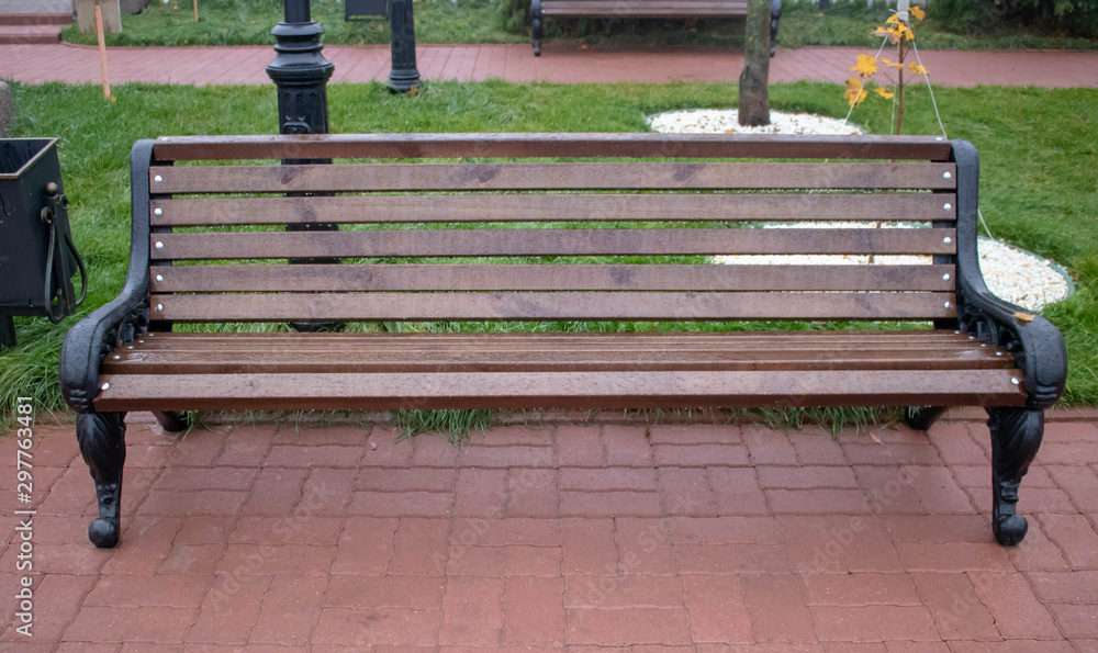Wet bench in the rain in the autumn Park Wet bench in the rain in the autumn Park
