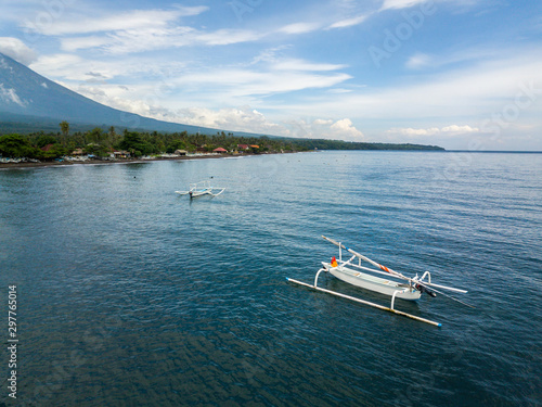 Aerial view of traditional fishing boats called jukung in Bali, Indonesia.