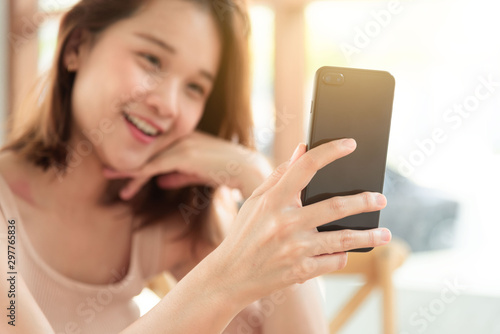 Beautiful young woman hand take smart phone look message from lovers. Send a message encouraging.