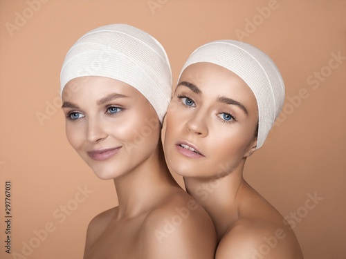 Portrait of beautiful young women isolated on brown studio background. Caucasian female models looking at camera and posing. Concept of women's health and beauty, self-care, body, skin care, treatment