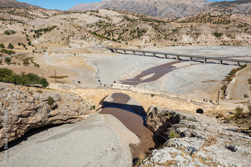 The historical Severan Bridge Adiyaman, which is located on the Cendere River and is considered one of the oldest used bridges in the world. It is located in an ancient settlement area Eskikale. photo