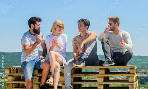 We like spending time together. best friends. Summer vacation. group of four people. great fit for day off. young people talking together. Group of people in casual wear. happy men and girl relax