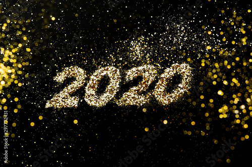 Abstract composition. Christmas, New 2020 year in golden glitter with beautiful bokeh on dark background photo