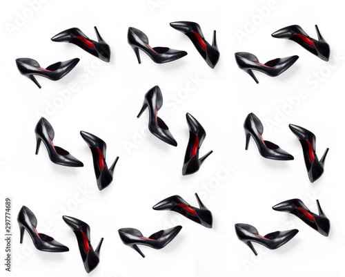 Pattern of black, women's, leather high-heeled shoes on a white background. Background for blog, shoe store, shoe manufacturer