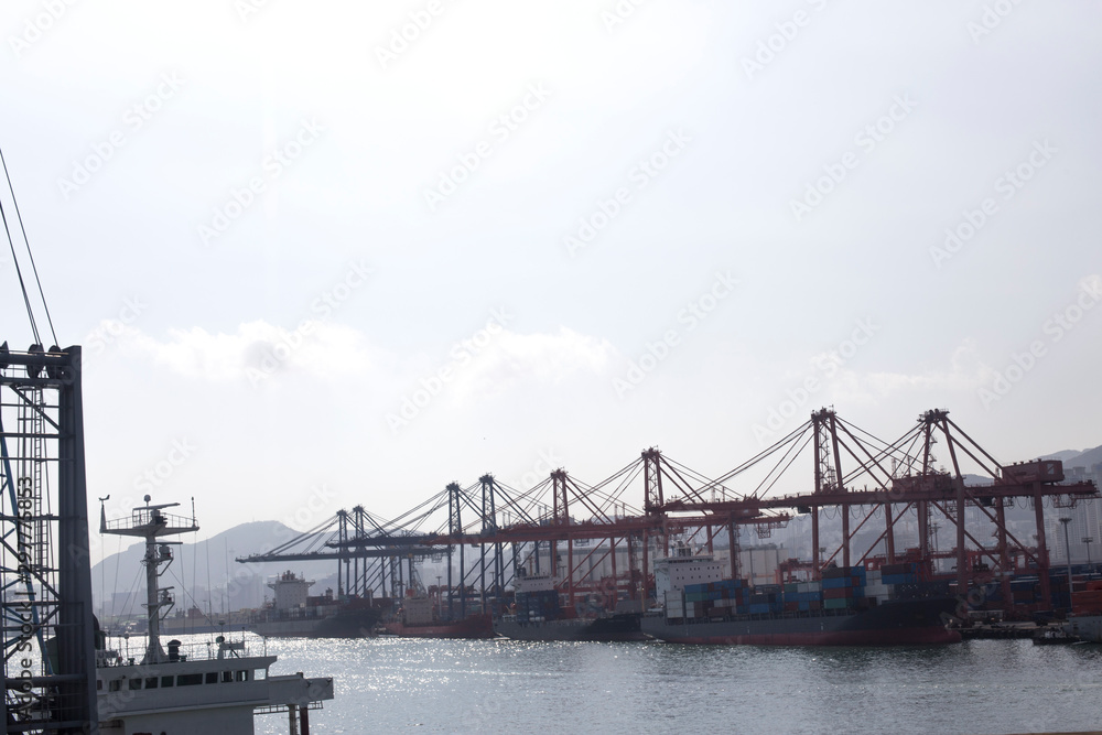 Fototapeta premium Container cargo ship and Gantry Cranes