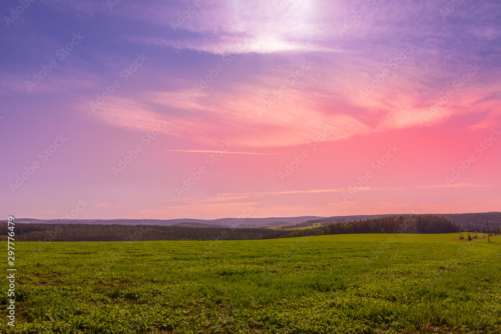 orange sunset over a field