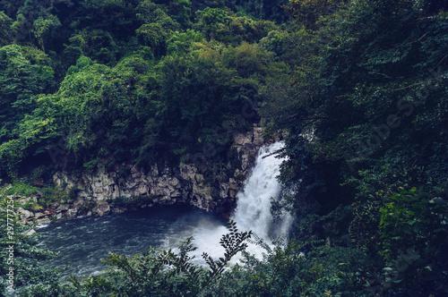 view from above on the waterfall in forest photo