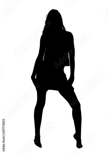Black silhouette of a slender young barefoot girl in a  summer dress who poses beautifully and flirts in front of the photographer