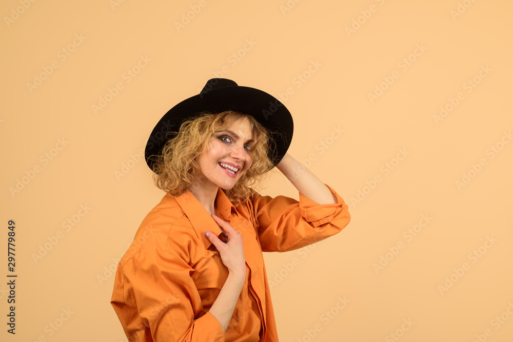Female autumn fashion. Happy girl in black hat. Beauty, fashion, female accessories. Sexy girl with bright makeup. Fashionable woman in hat and orange shirt. Stylish sexy blonde model in black hat. Female autumn fashion. Happy girl in black hat. Beauty, fashion, female accessories. Sexy girl with bright makeup. Fashionable woman in hat and orange shirt. Stylish sexy blonde model in black hat.