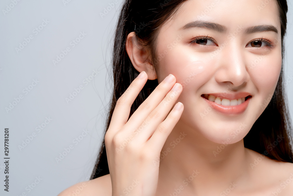 beauty asian attractive female bare healthy facial skin hand touch serum of cheek portrait half body make up skin concept beauty asian attractive female bare healthy facial skin hand touch serum of cheek portrait half body make up skin concept