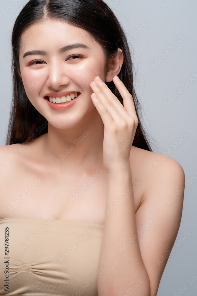 beauty asian attractive female bare healthy facial skin hand touch serum of cheek portrait half body make up skin concept beauty asian attractive female bare healthy facial skin hand touch serum of cheek portrait half body make up skin concept