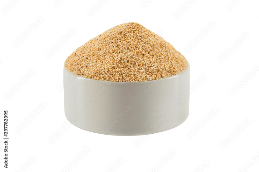 Ground garlic in a bowl isolated on white background with copy space for text or images. Spices and herbs. Packaging concept. Close-up. Ground garlic in a bowl isolated on white background with copy space for text or images. Spices and herbs. Packaging concept. Close-up.