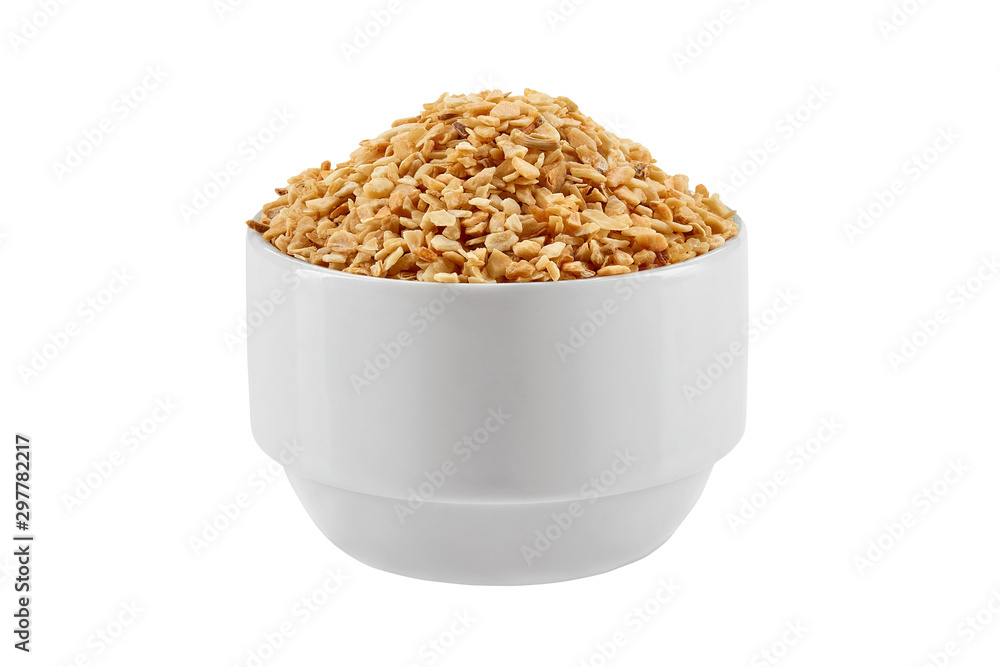 Chopped garlic in a bowl isolated on white background with copy space for text or images. Spices and herbs. Packaging concept. Close-up. Chopped garlic in a bowl isolated on white background with copy space for text or images. Spices and herbs. Packaging concept. Close-up.