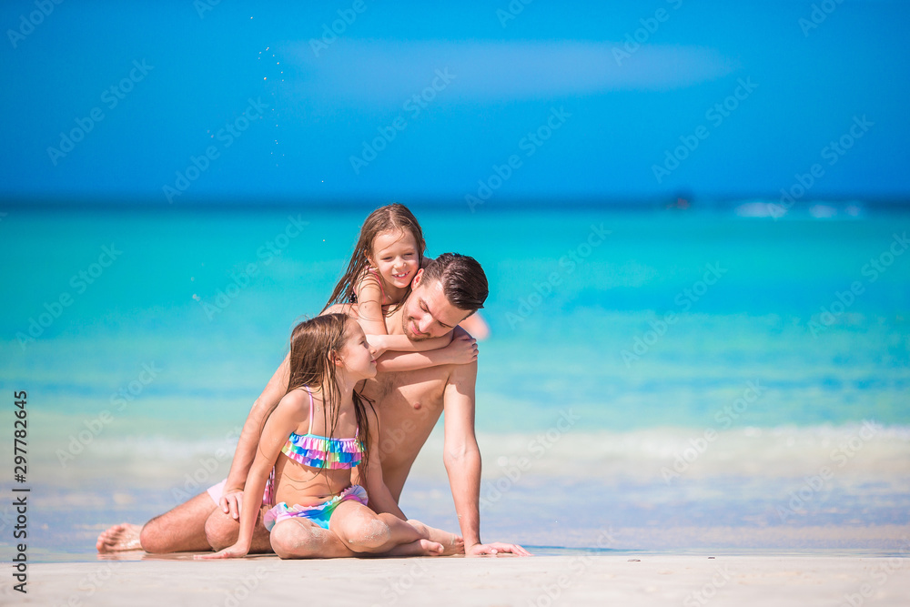 Father and kids enjoying beach summer vacation Father and kids enjoying beach summer vacation
