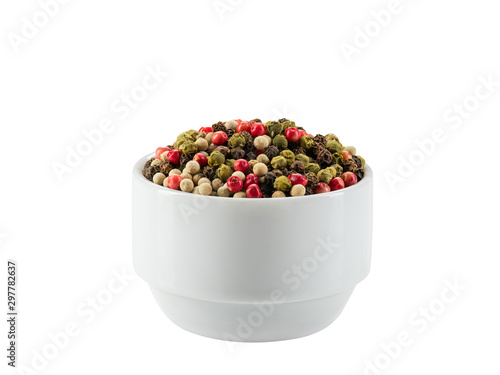 Mixture of peppercorns in a bowl isolated on white background with copy space for text or images. Spices and herbs. Packaging concept. Close-up.