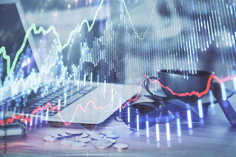 Financial graph colorful drawing and table with computer on background. Double exposure. Concept of international markets. Financial graph colorful drawing and table with computer on background. Double exposure. Concept of international markets.