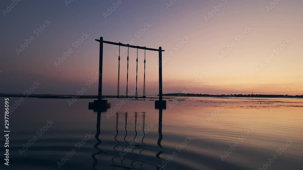 Silhouette of giant swing with sunset background Silhouette of giant swing with sunset background