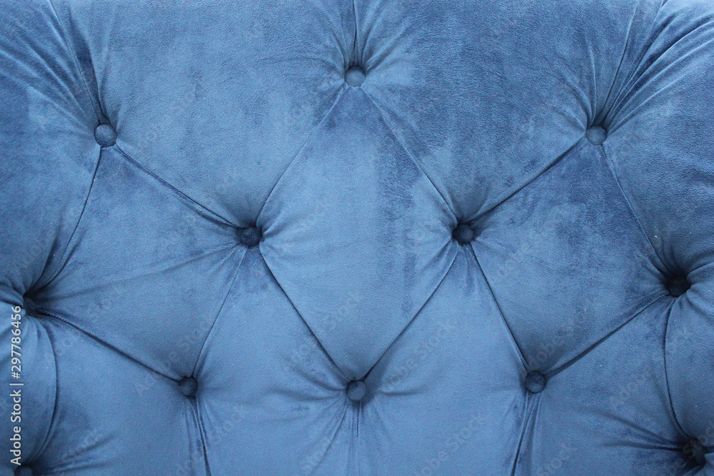 Detail of classic furniture. Velour sofa close up. Blue soft fabric