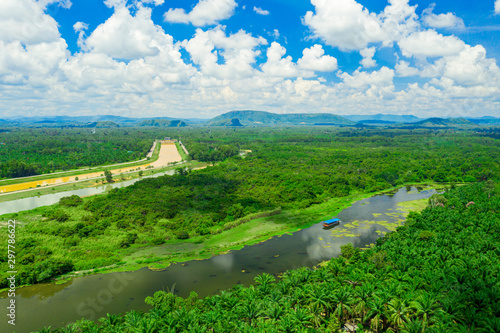 Aerial view of natural reservoir with green plants in Chumphon province, Thailand. Aerial landscape of green palm tree in Chumpahon province. photo