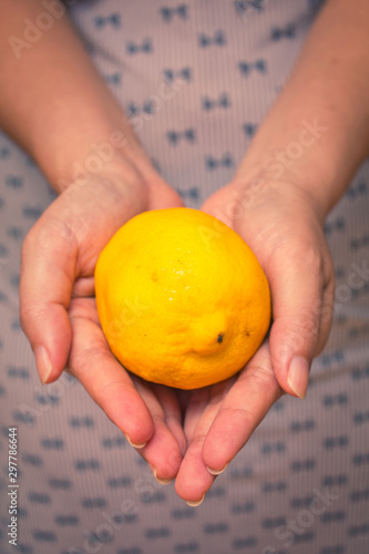 Hands giving away a lemon
