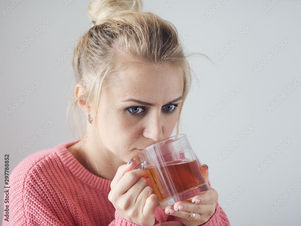 portrait of a girl who holds a cup of tea portrait of a girl who holds a cup of tea