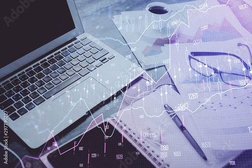 Forex market chart hologram and personal computer background. Double exposure. Concept of investment.