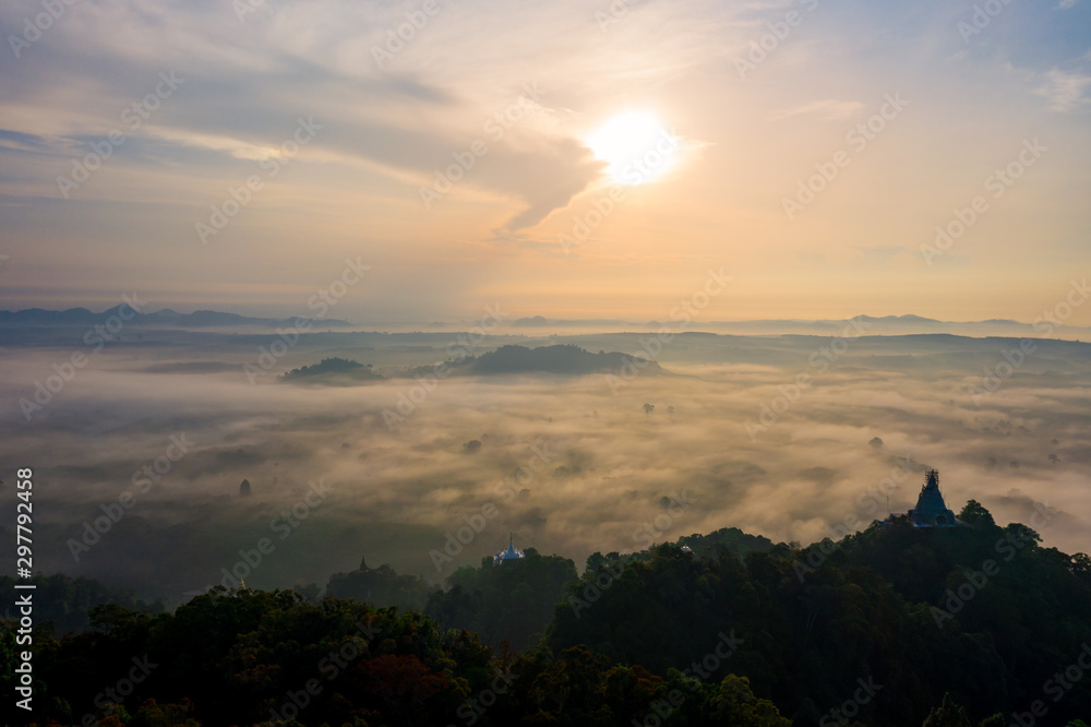 Fototapeta premium Morning sunrise with cloud over mountain in Surat Thani province, Thailand
