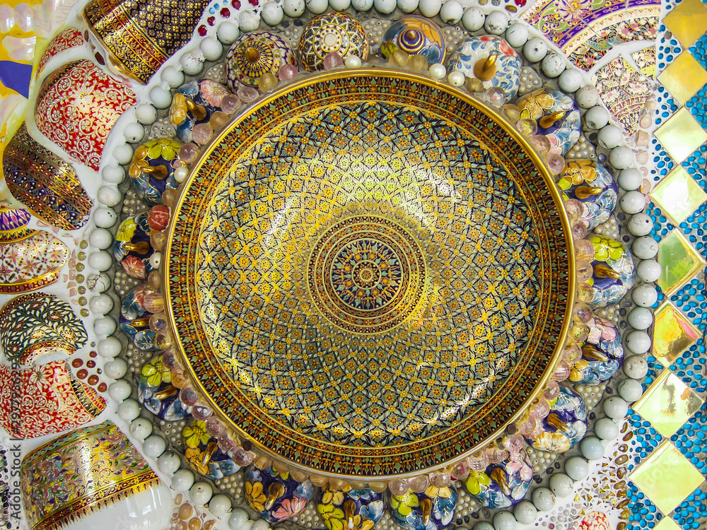 Sculpture decorative on cement wall ,using glass and ceramic at the Wat-Pha-Kaew, Phetchabun Province, Thailand