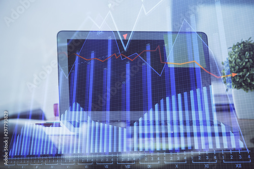 Financial chart drawing and table with computer on background. Double exposure. Concept of international markets. © peshkova