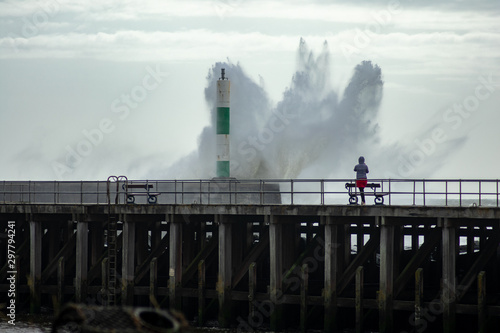 Strong winds create big waves that batter into Aberystwyth, Mid Wales sea front during the Storm season.