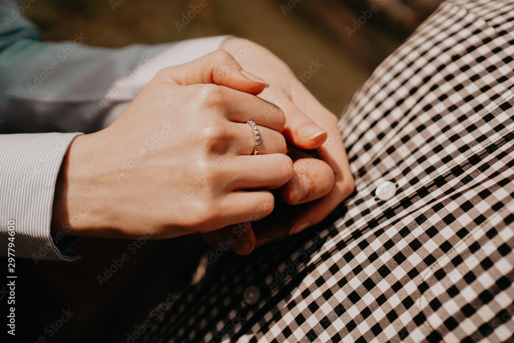 Hands of couple. Couple of lovers holding hands. Hand with ring