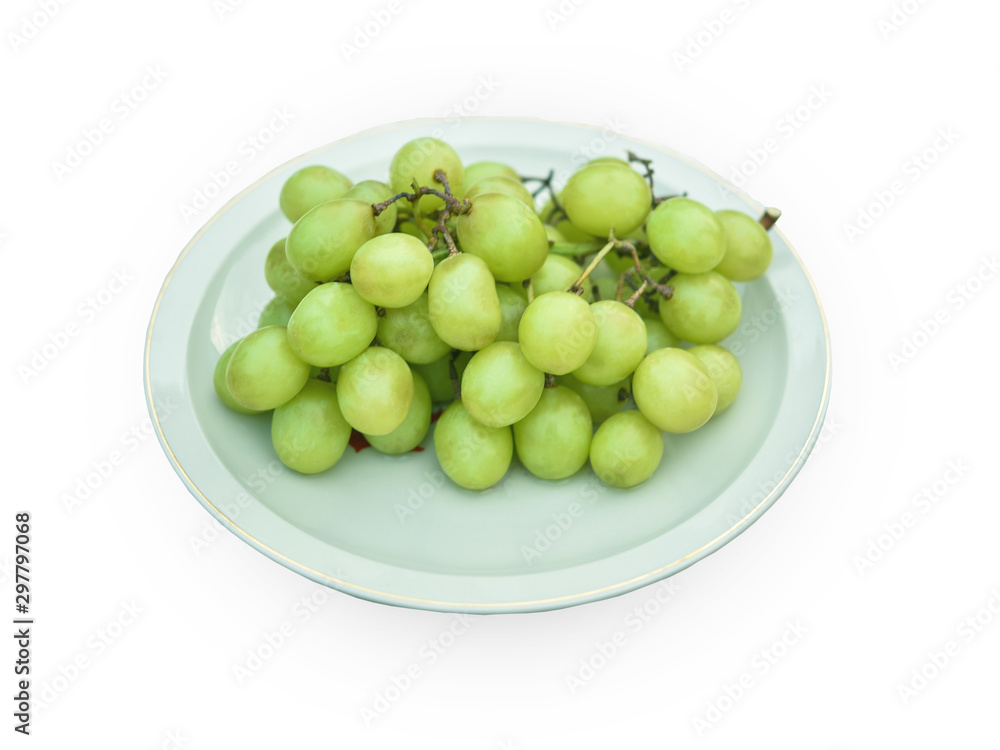 Green grapes on a white background plate Green grapes on a white background plate
