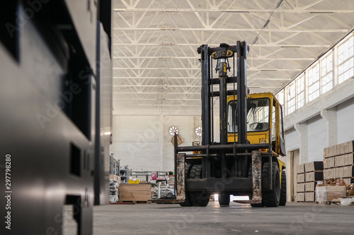 An old forklift is waiting to pick a next load.