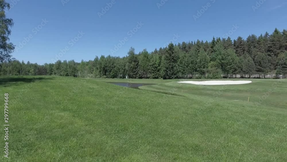 Aerial landscape flight over golf course country club with lake and pond surrounded by big trees and green grass. Drone shots. Aerial landscape flight over golf course country club with lake and pond surrounded by big trees and green grass. Drone shots.