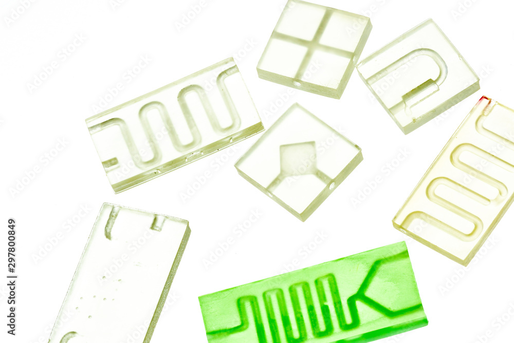 Organ-on-a-chip (OOC) - microfluidic device chip that simulates biological organs that is type of artificial organ. Prototype of design lab-on-a-chip in microfluidic laboratory Organ-on-a-chip (OOC) - microfluidic device chip that simulates biological organs that is type of artificial organ. Prototype of design lab-on-a-chip in microfluidic laboratory
