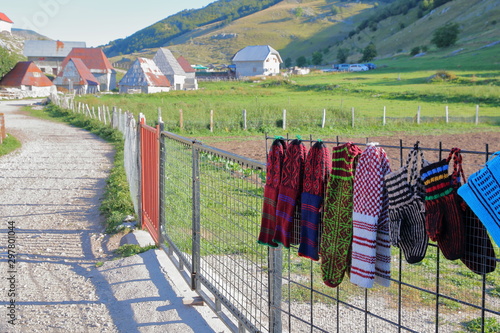 Lukomir village, with wool socks and gloves (on sale for tourists) in the foreground. Lukomir is Bosnia's highest village at 1469 meters and the most remote in the entire country, Bosnia and Herzegovi photo