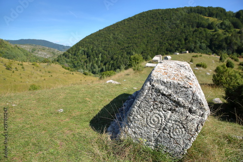 Stecak tombstones (decorated with symbolic motifs) located close to Umoljani village in the Bjelasnica mountains, Bosnia and Herzegovina photo