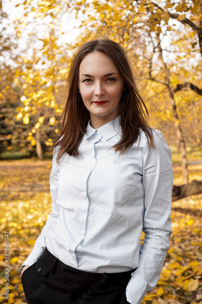 Portrait of beautiful young woman in autumn park - sunny day Portrait of beautiful young woman in autumn park - sunny day