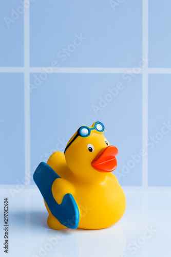 Yellow rubber duck with surfboard