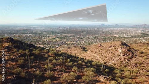 Triangle Alien Spaceship Hovering over Phoenix Arizona City Illustration Powerful Video Illustration using real footage with visual effect elements of Large Triangle Alien Spaceship Hovers over Phoeni photo